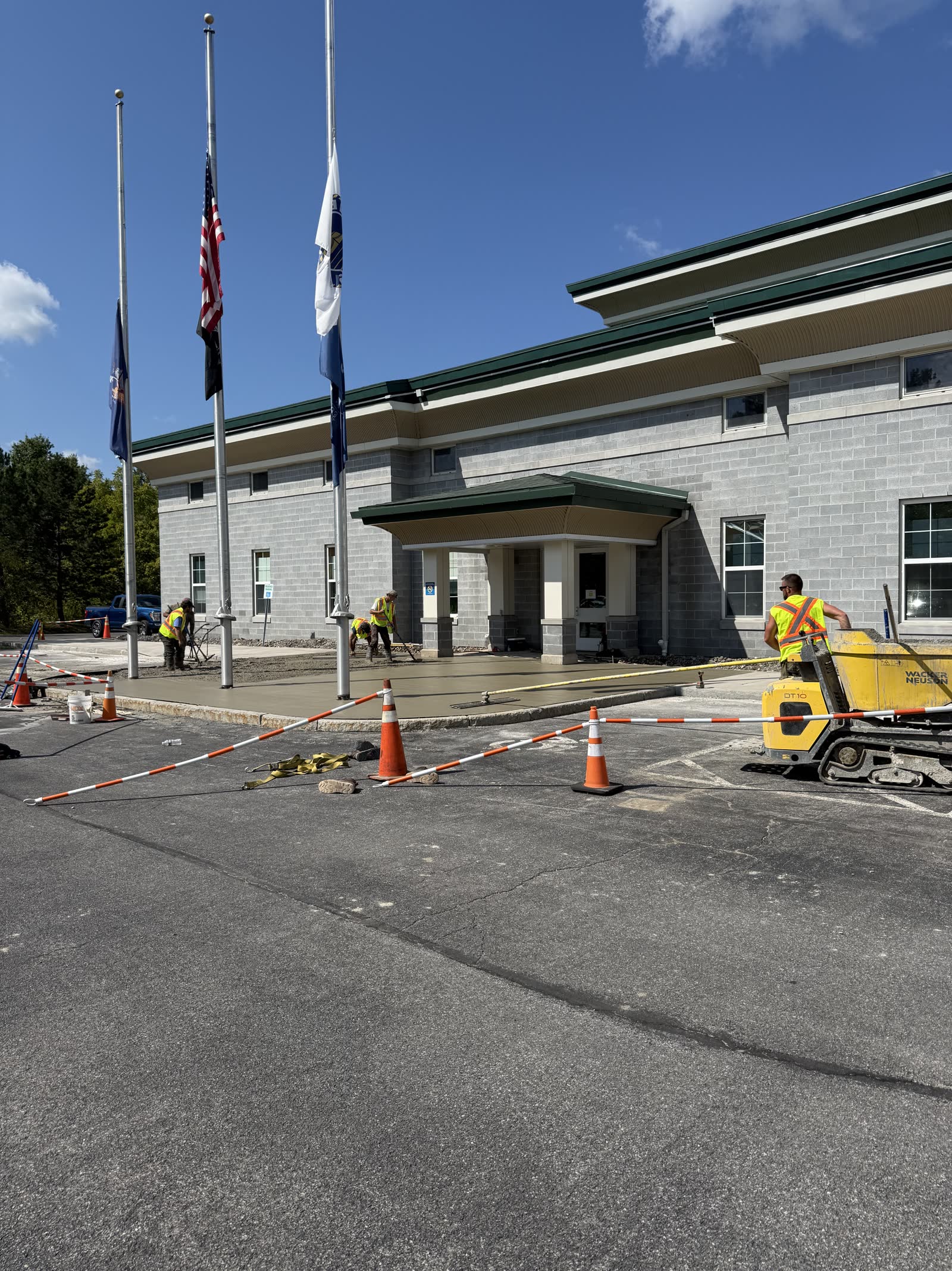 Concrete sidewalk work at a public facility